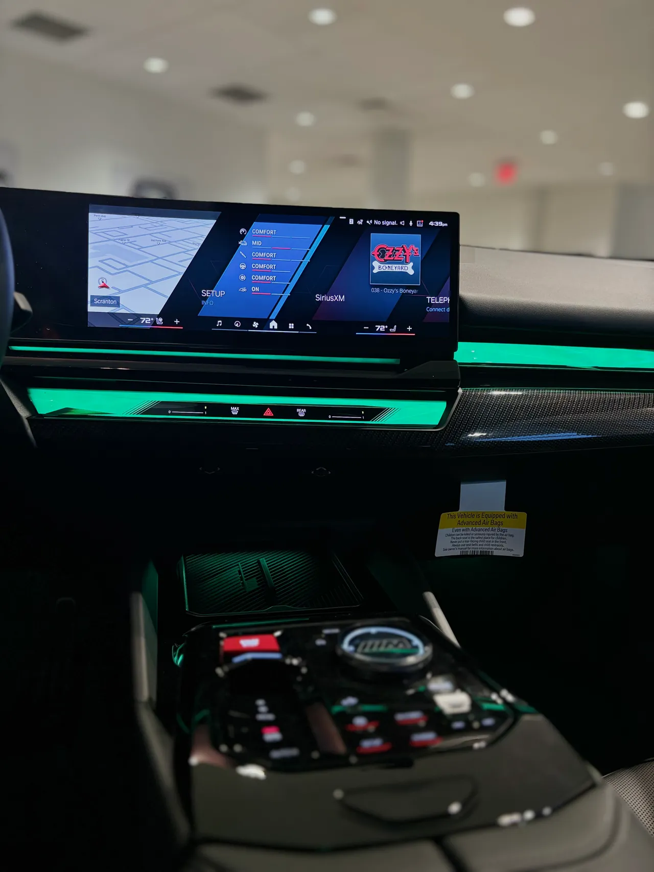 Curved dashboard display and ambient lighting in a new car interior